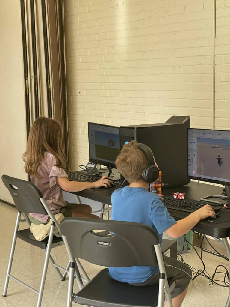 2 Kids on computer at STEM camp in Garner NC